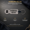 Silberfarbener Einkaufswagenlöser Hamburg Rules aus Metall mit drei Produktvorteilen