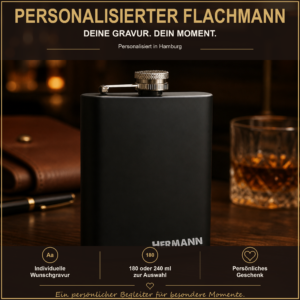 Schwarzer Edelstahl-Flachmann mit Wunschgravur in warmer Geschenkdekoration